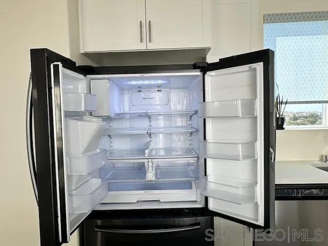 2036 Mayon Road Chula Vista, CA 91915 - Photo 41 of 49 a refrigerator freezer sitting inside of a kitchen