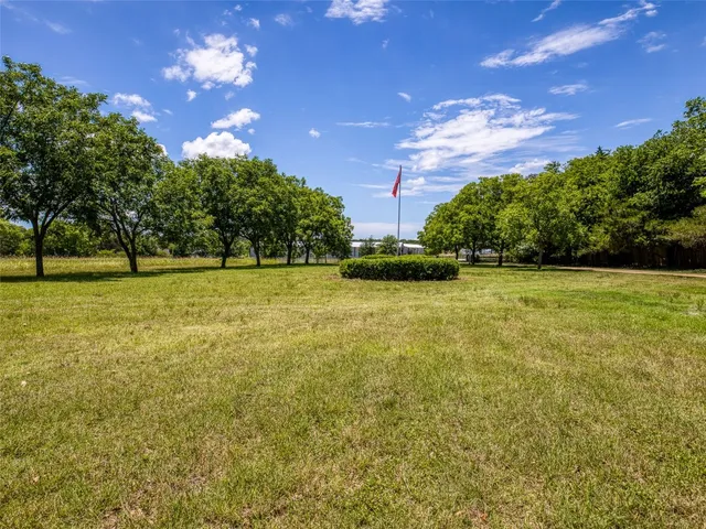 a view of a swimming pool with an outdoor space and seating area