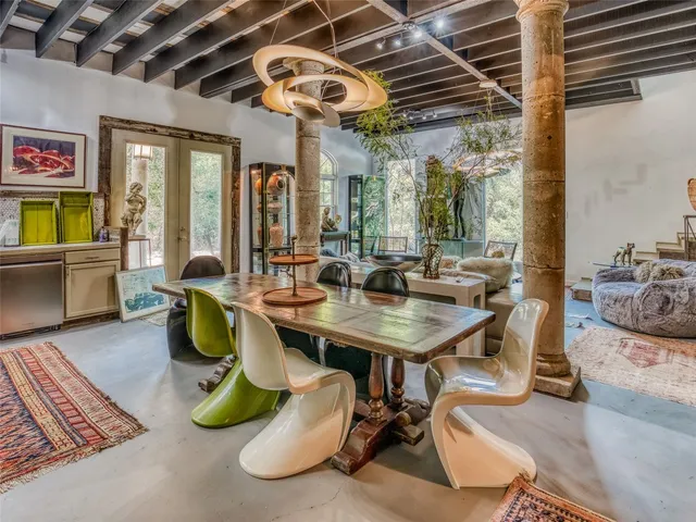 a view of a dining room with furniture window and outside view