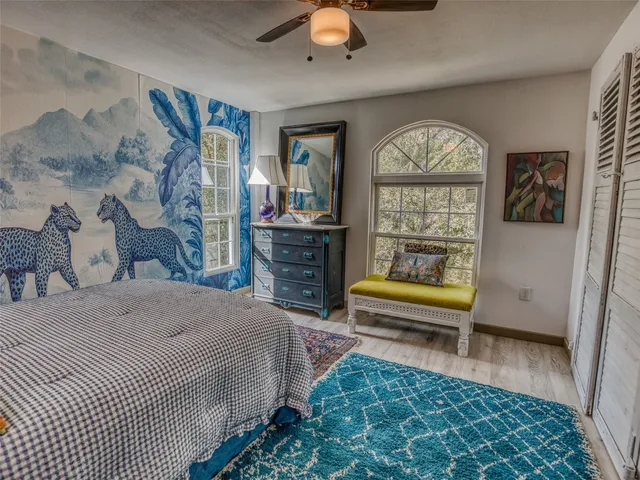 a bedroom with furniture and a window