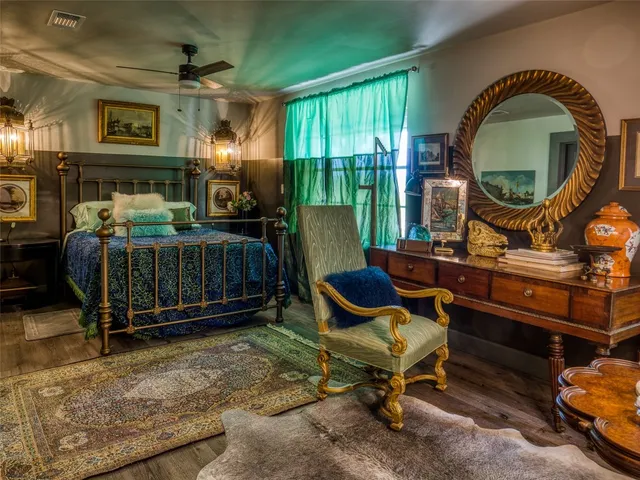 a bedroom with furniture and a fireplace