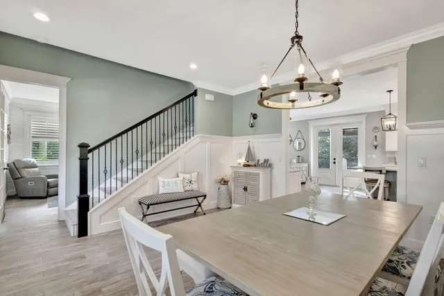 a large kitchen with kitchen island a large counter space a sink stainless steel appliances and cabinets