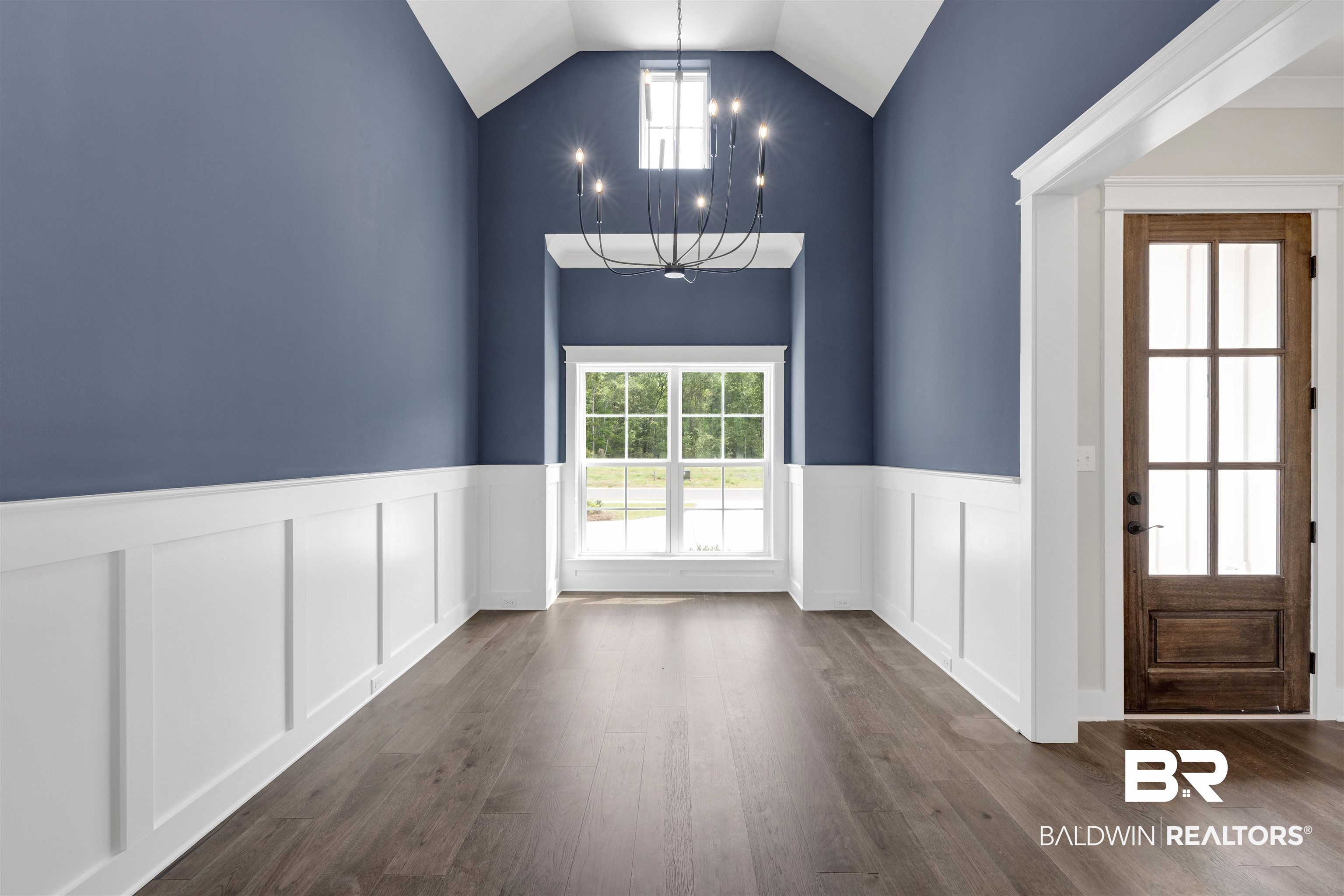 27315 Patch Pl Loop Daphne, AL 36526 - Photo 7 of 43 Dining room with wainscoting, suspended lighting, wood finished floors, and a high ceiling