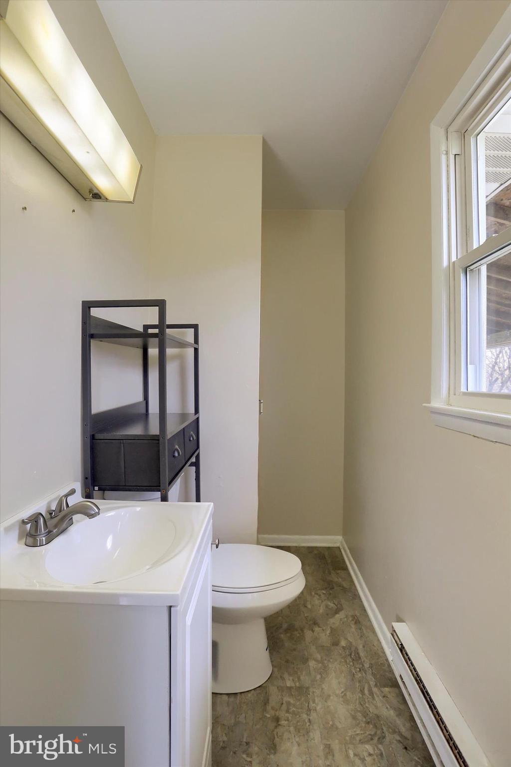 127 Spring Road Dillsburg, PA 17019 - Photo 20 of 39 a bathroom with a sink a toilet and window