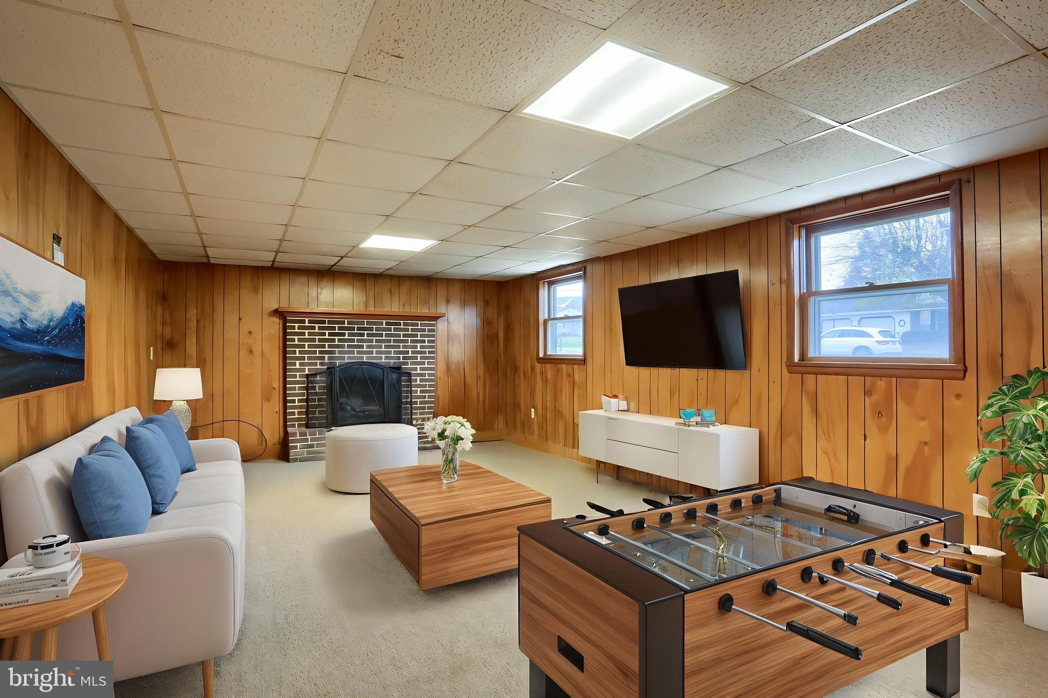 127 Spring Road Dillsburg, PA 17019 - Photo 25 of 39 a living room with furniture a flat screen tv and a fireplace