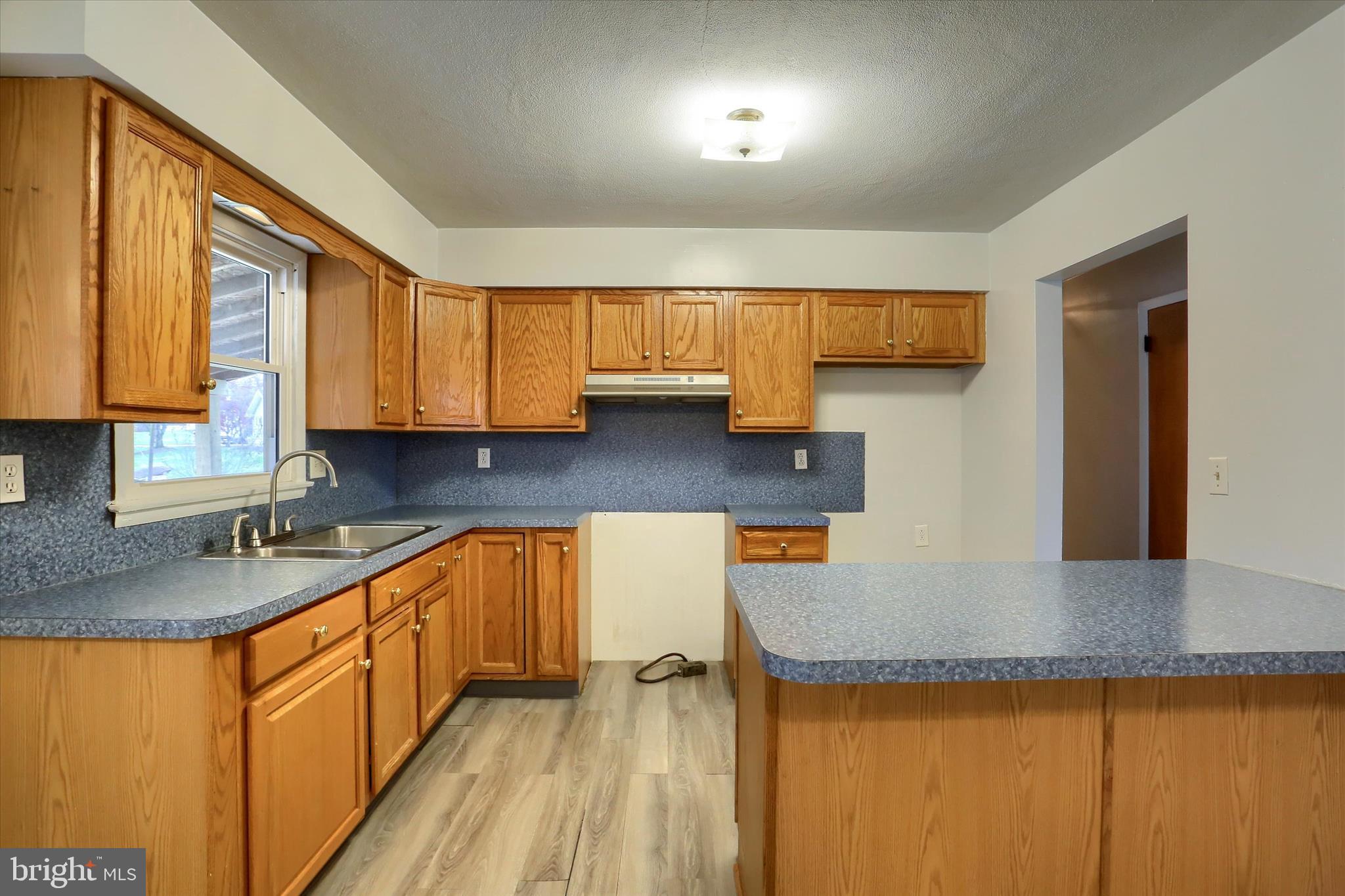 127 Spring Road Dillsburg, PA 17019 - Photo 8 of 39 a kitchen with stainless steel appliances granite countertop a sink stove and cabinets
