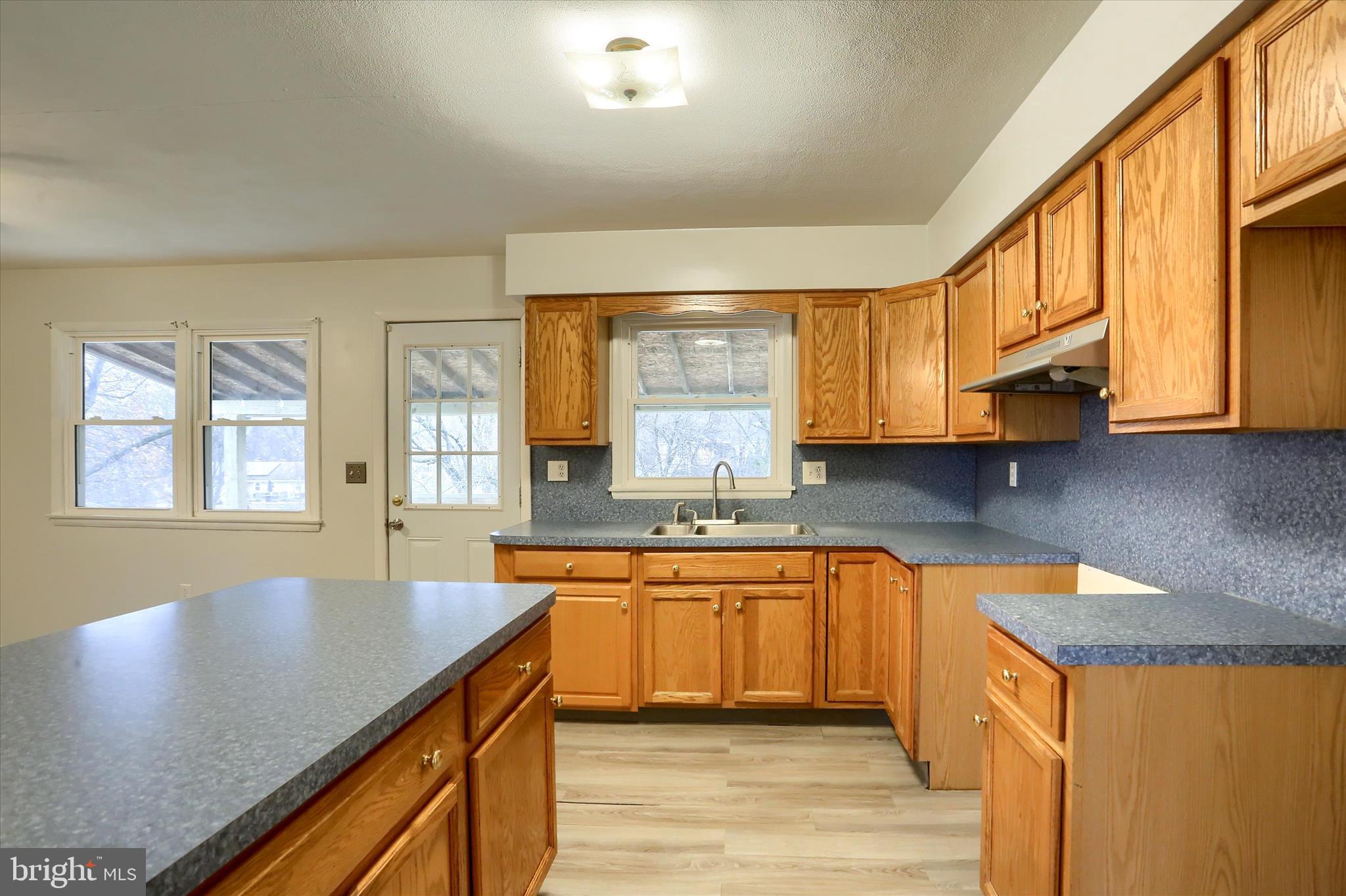 127 Spring Road Dillsburg, PA 17019 - Photo 9 of 39 a kitchen with stainless steel appliances granite countertop sink stove top oven and cabinets