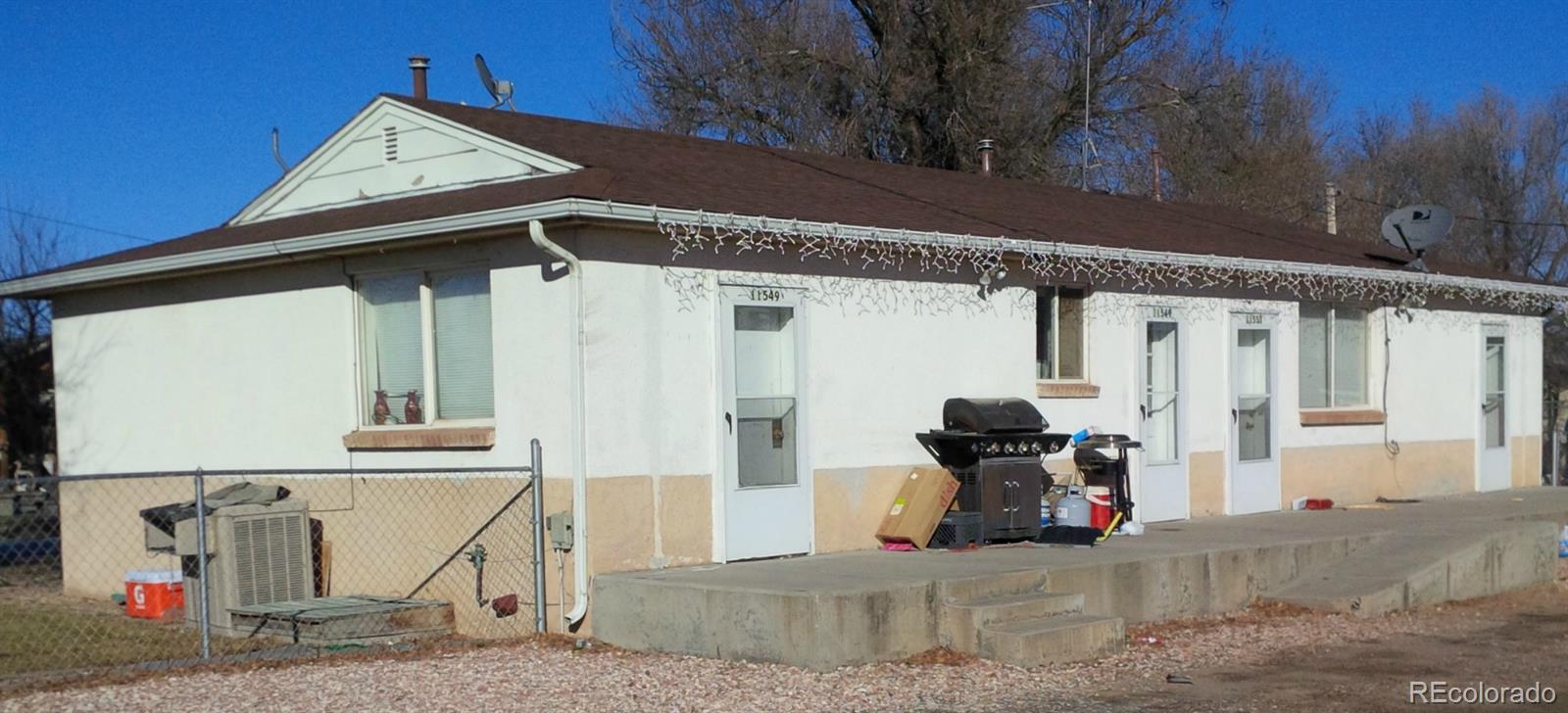 a view of a house with large windows