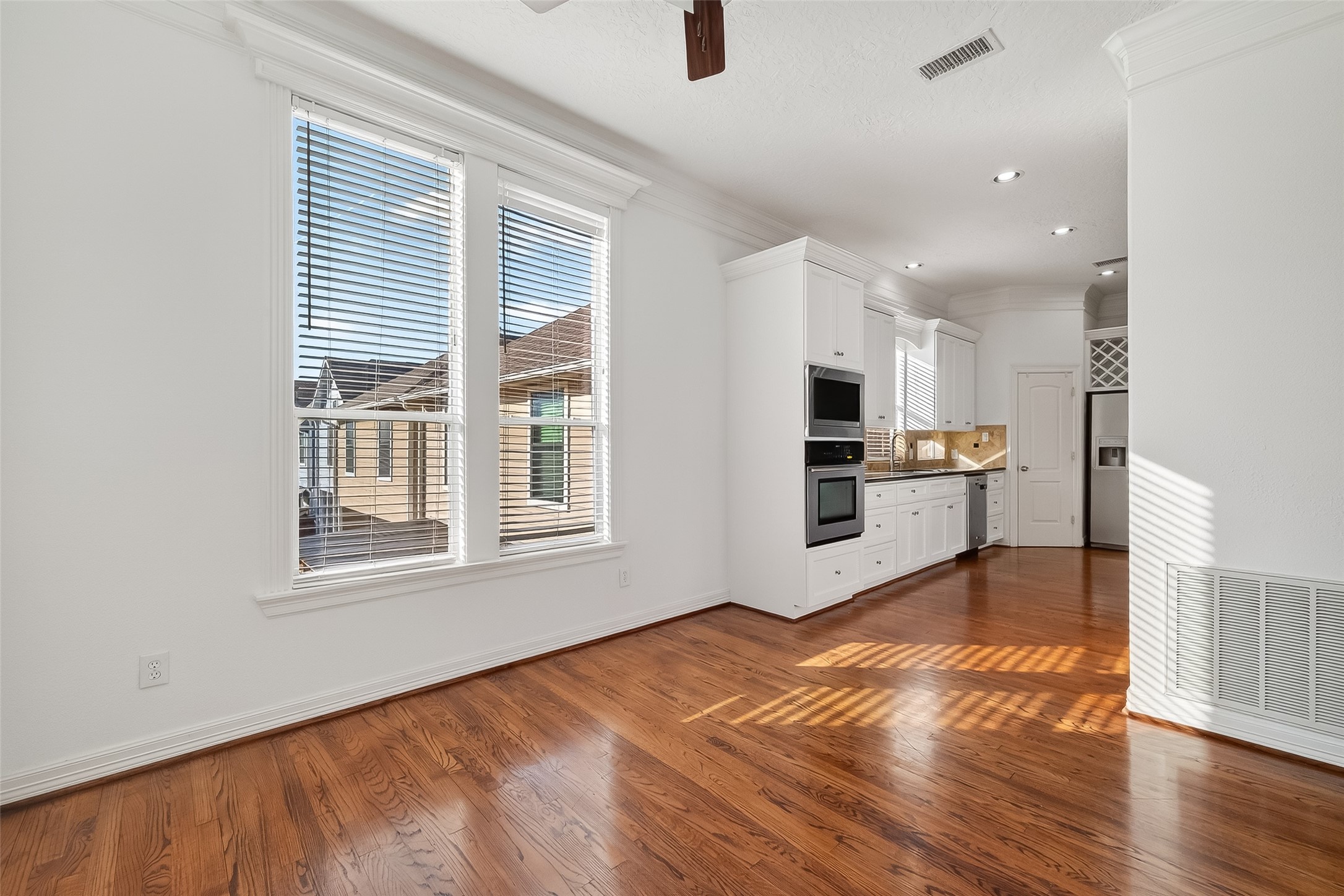 1002 West 22nd Street Houston, TX 77008 - Photo 15 of 43 a view of a kitchen with microwave and cabinets