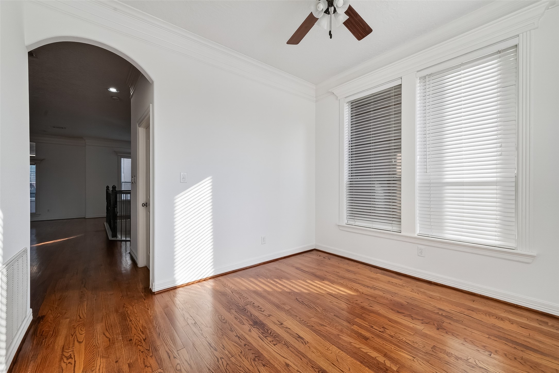1002 West 22nd Street Houston, TX 77008 - Photo 17 of 43 an empty room with wooden floor and windows