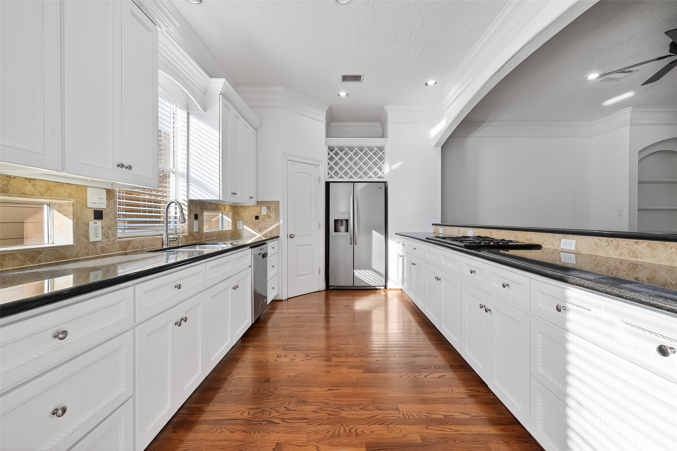 1002 West 22nd Street Houston, TX 77008 - Photo 18 of 43 a large white kitchen with granite countertop lots of counter space and a sink