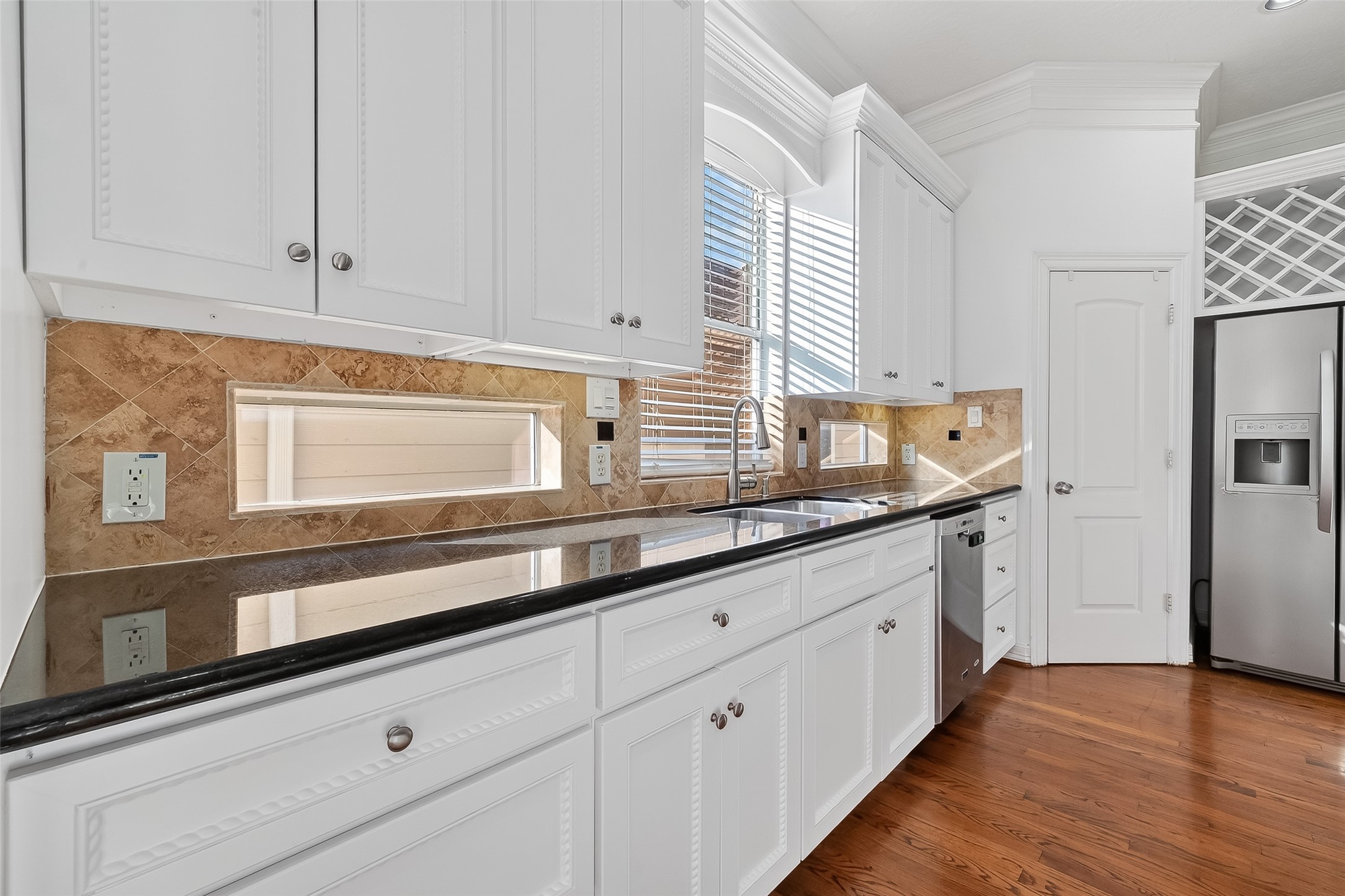 1002 West 22nd Street Houston, TX 77008 - Photo 21 of 43 a kitchen with granite countertop white cabinets and white appliances