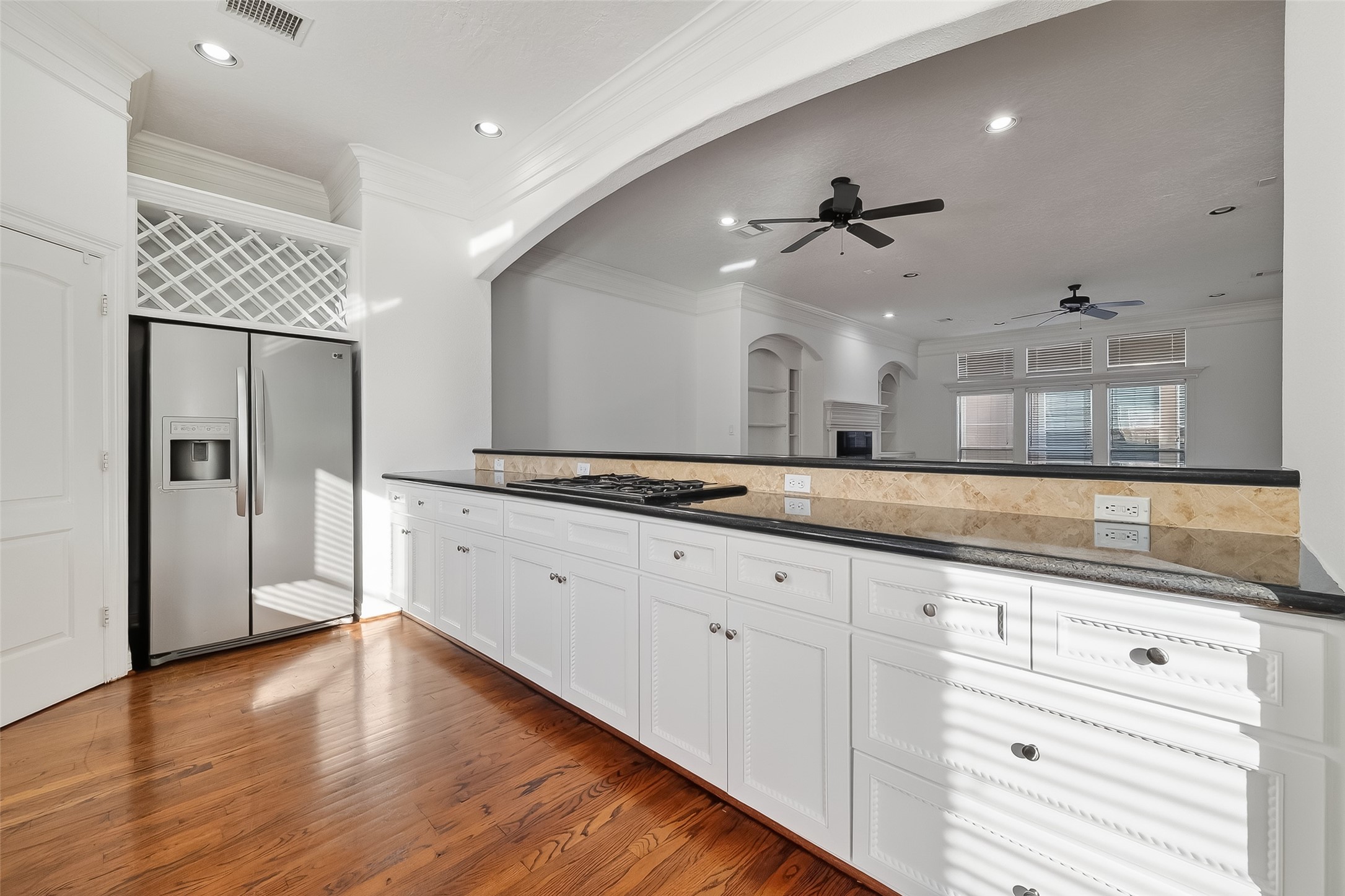 1002 West 22nd Street Houston, TX 77008 - Photo 22 of 43 a large kitchen with granite countertop a large counter top space appliances and cabinets