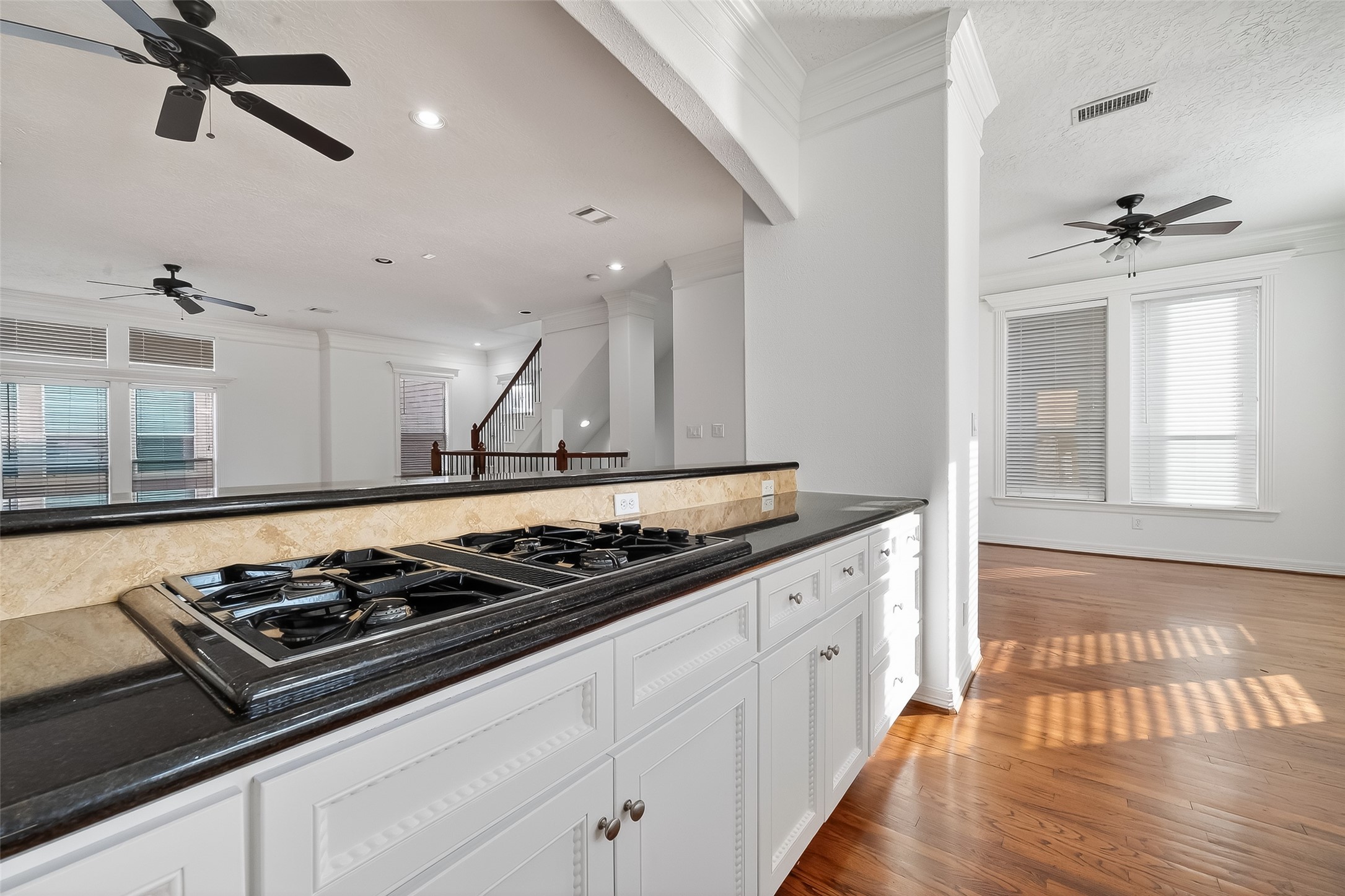 1002 West 22nd Street Houston, TX 77008 - Photo 23 of 43 a kitchen with a stove and wooden floor