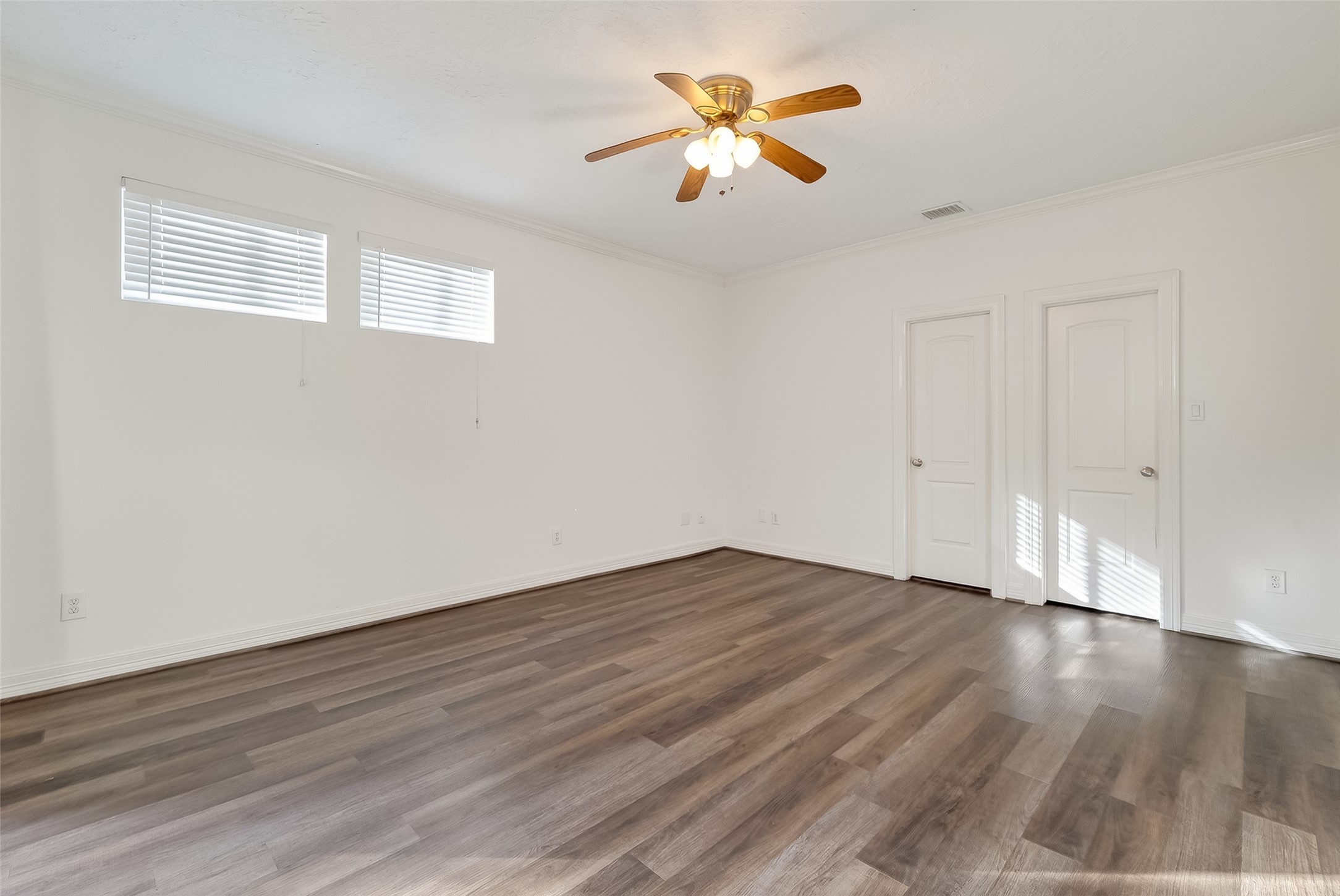 1002 West 22nd Street Houston, TX 77008 - Photo 25 of 43 a view of an empty room with a window and wooden floor