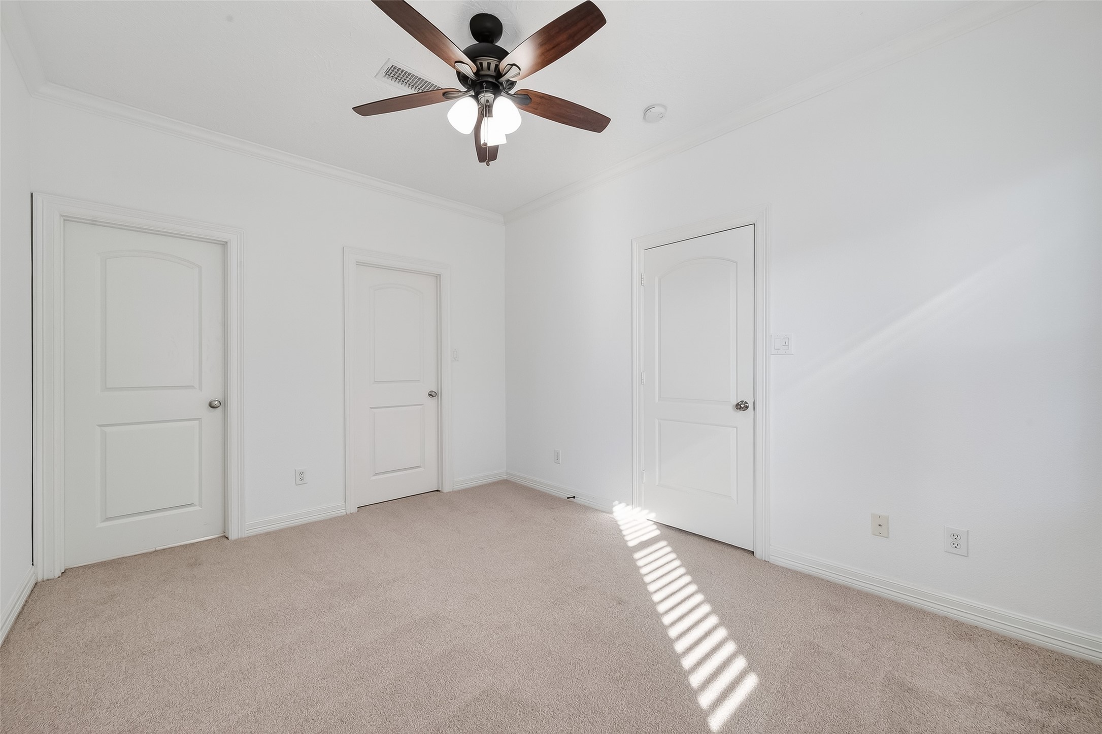 1002 West 22nd Street Houston, TX 77008 - Photo 39 of 43 an empty room with closet and a chandelier fan
