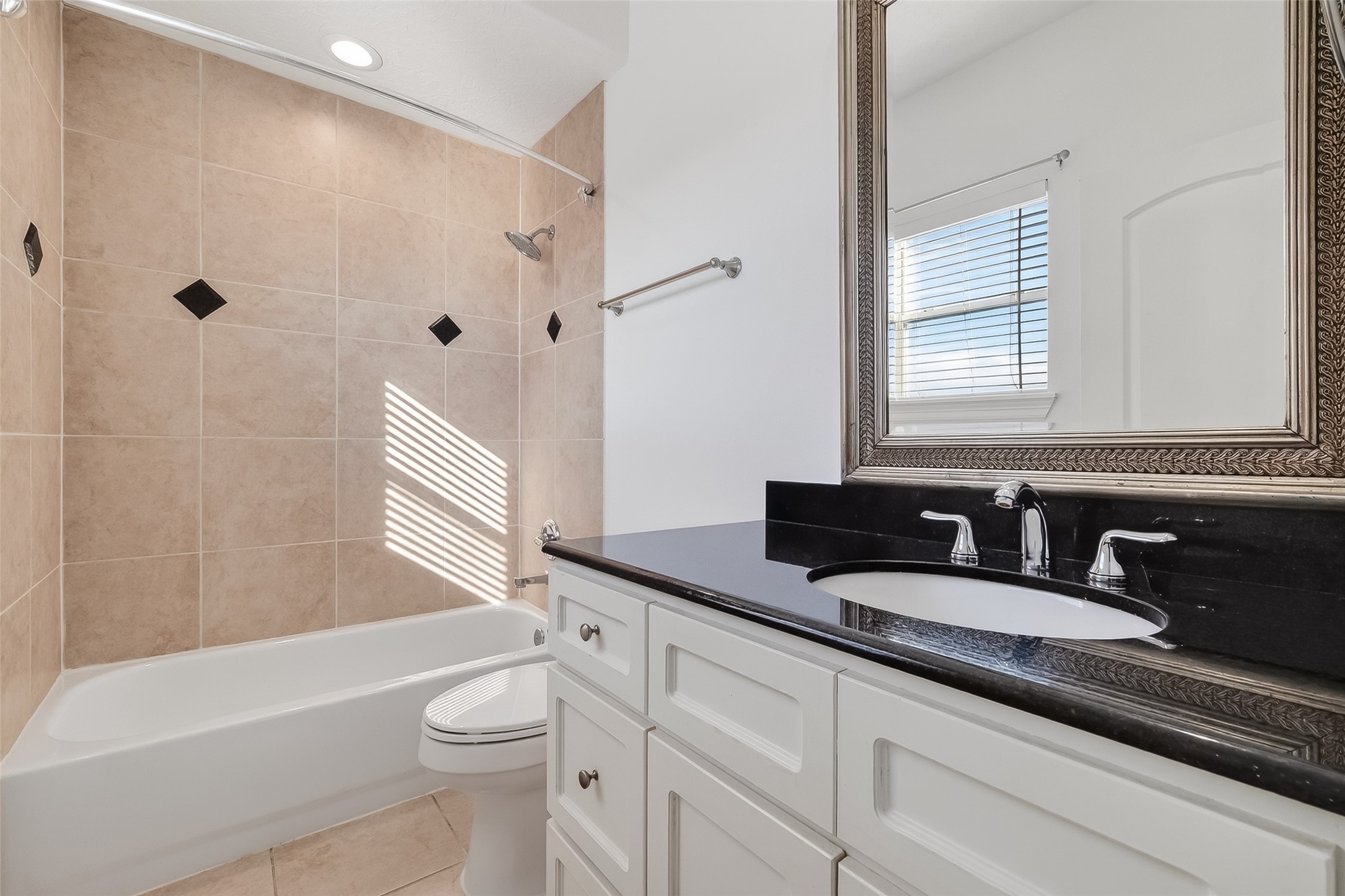1002 West 22nd Street Houston, TX 77008 - Photo 40 of 43 a bathroom with a granite countertop sink toilet and shower