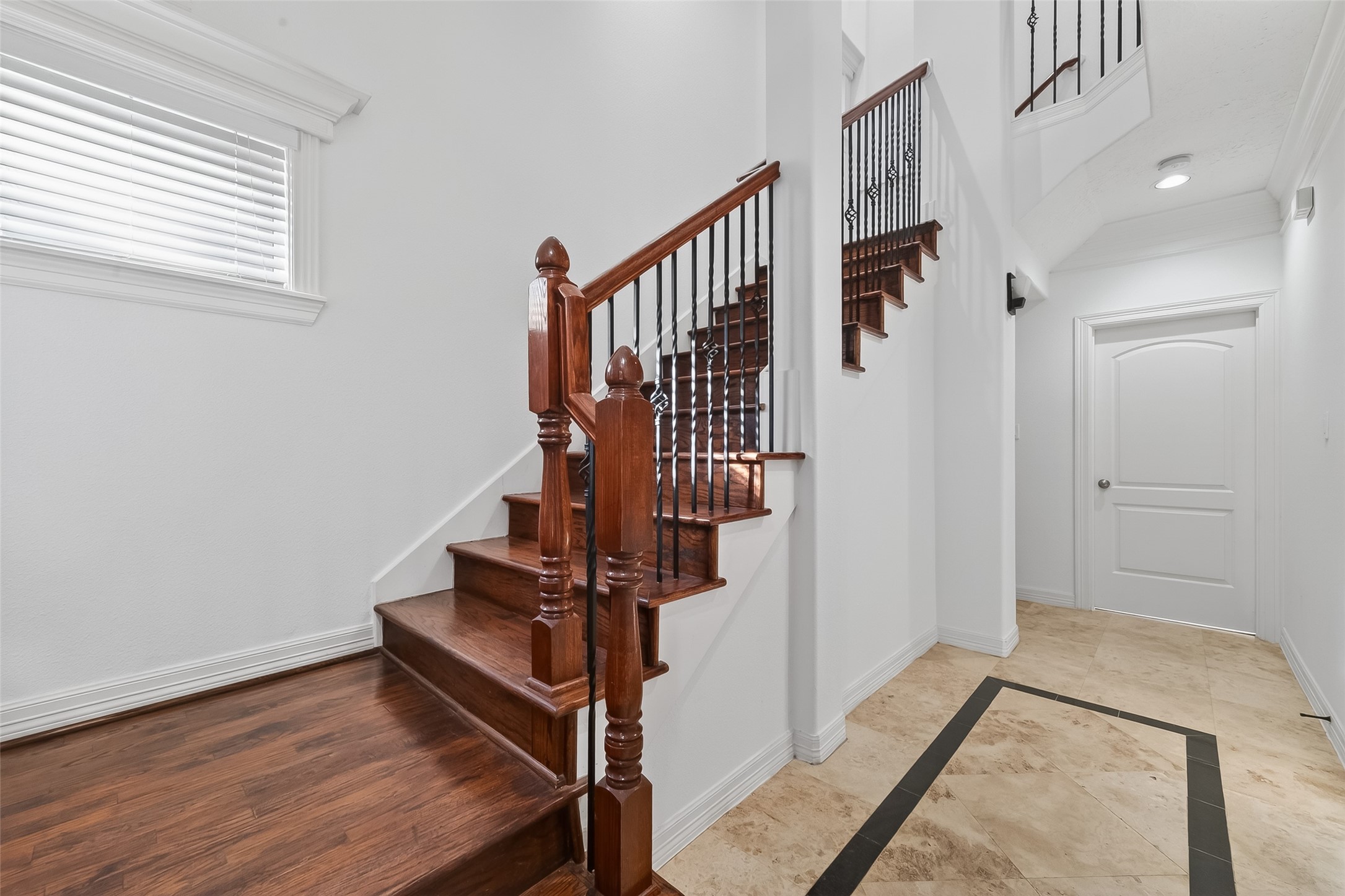 1002 West 22nd Street Houston, TX 77008 - Photo 5 of 43 a view of entryway with stairs and wooden floor