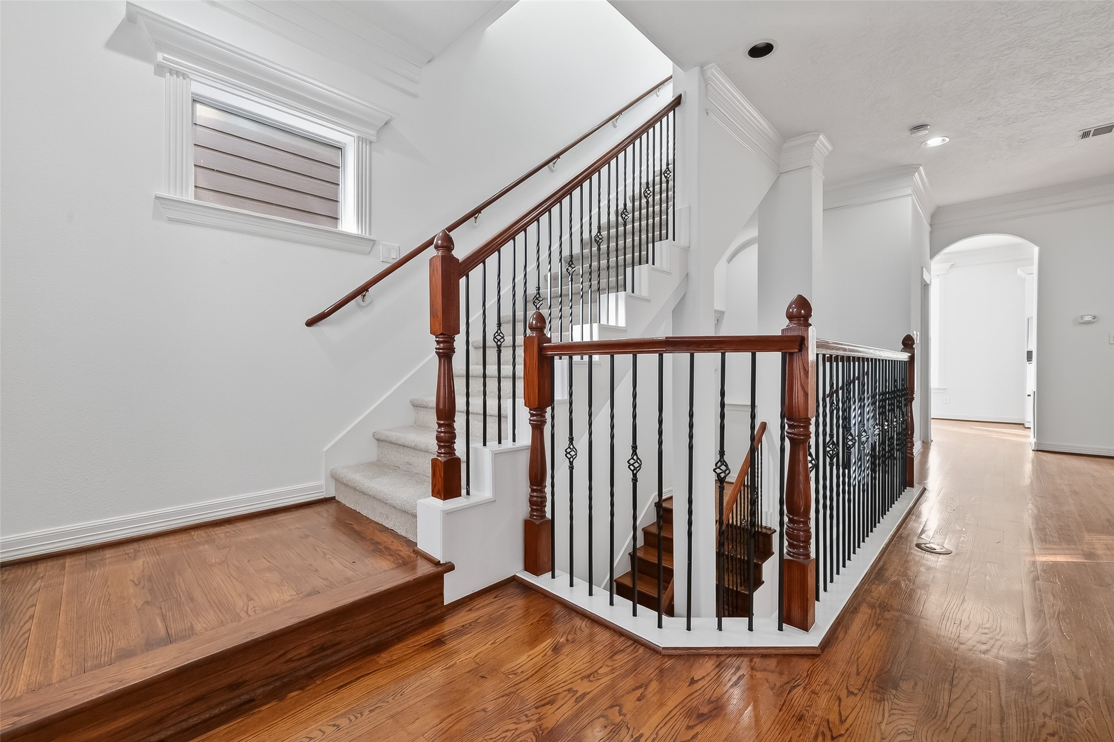 1002 West 22nd Street Houston, TX 77008 - Photo 6 of 43 a view of entryway with stairs and wooden floor