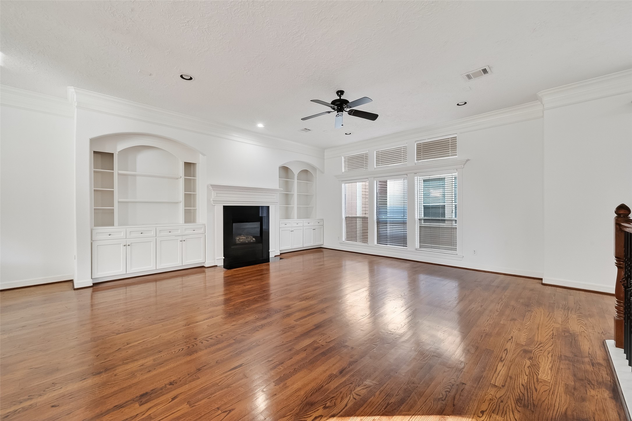 1002 West 22nd Street Houston, TX 77008 - Photo 10 of 43 a view of a livingroom with wooden floor and a ceiling fan
