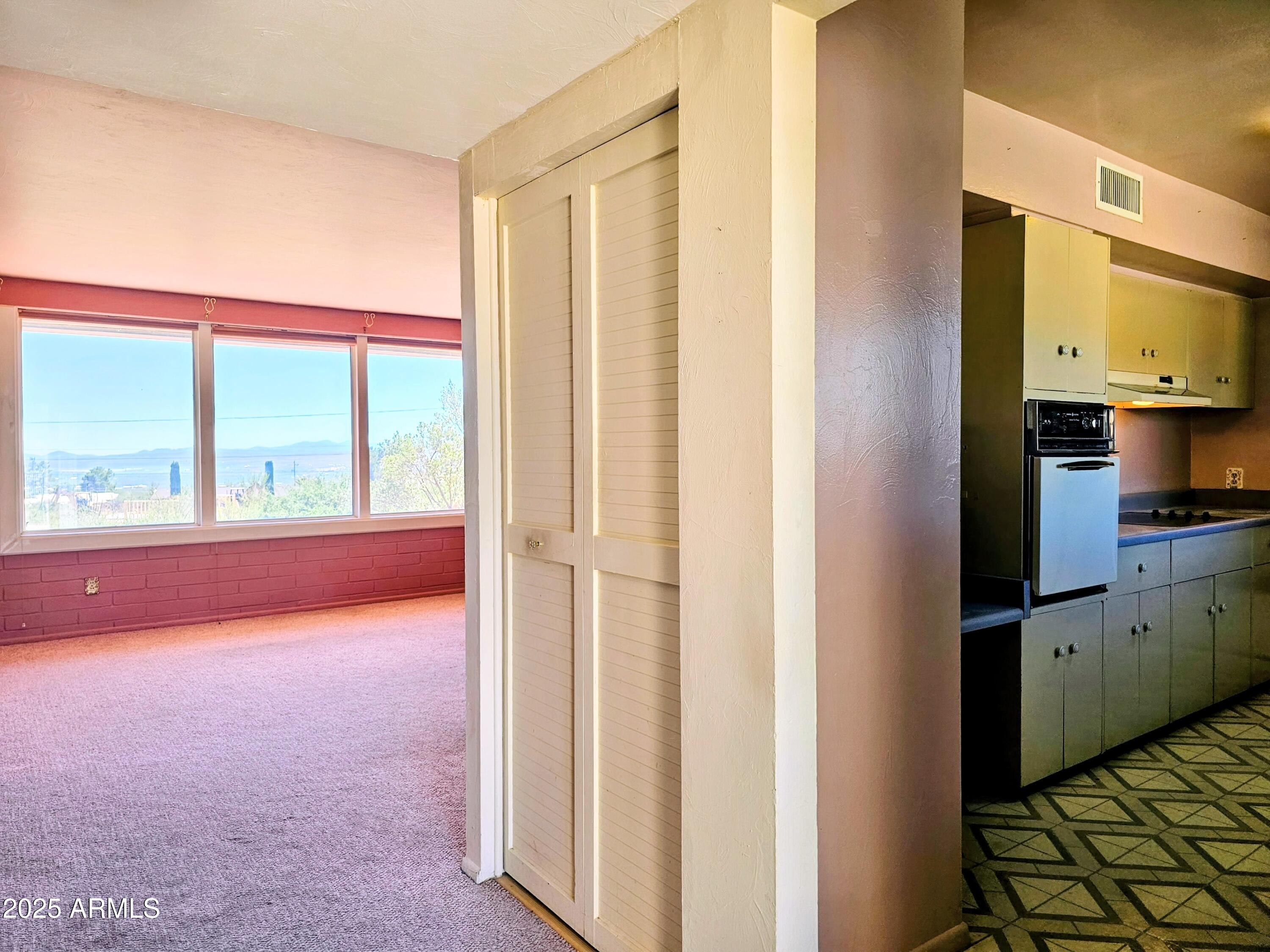 85 Pima Drive Bisbee, AZ 85603 - Photo 13 of 44 a view of an empty room with a window