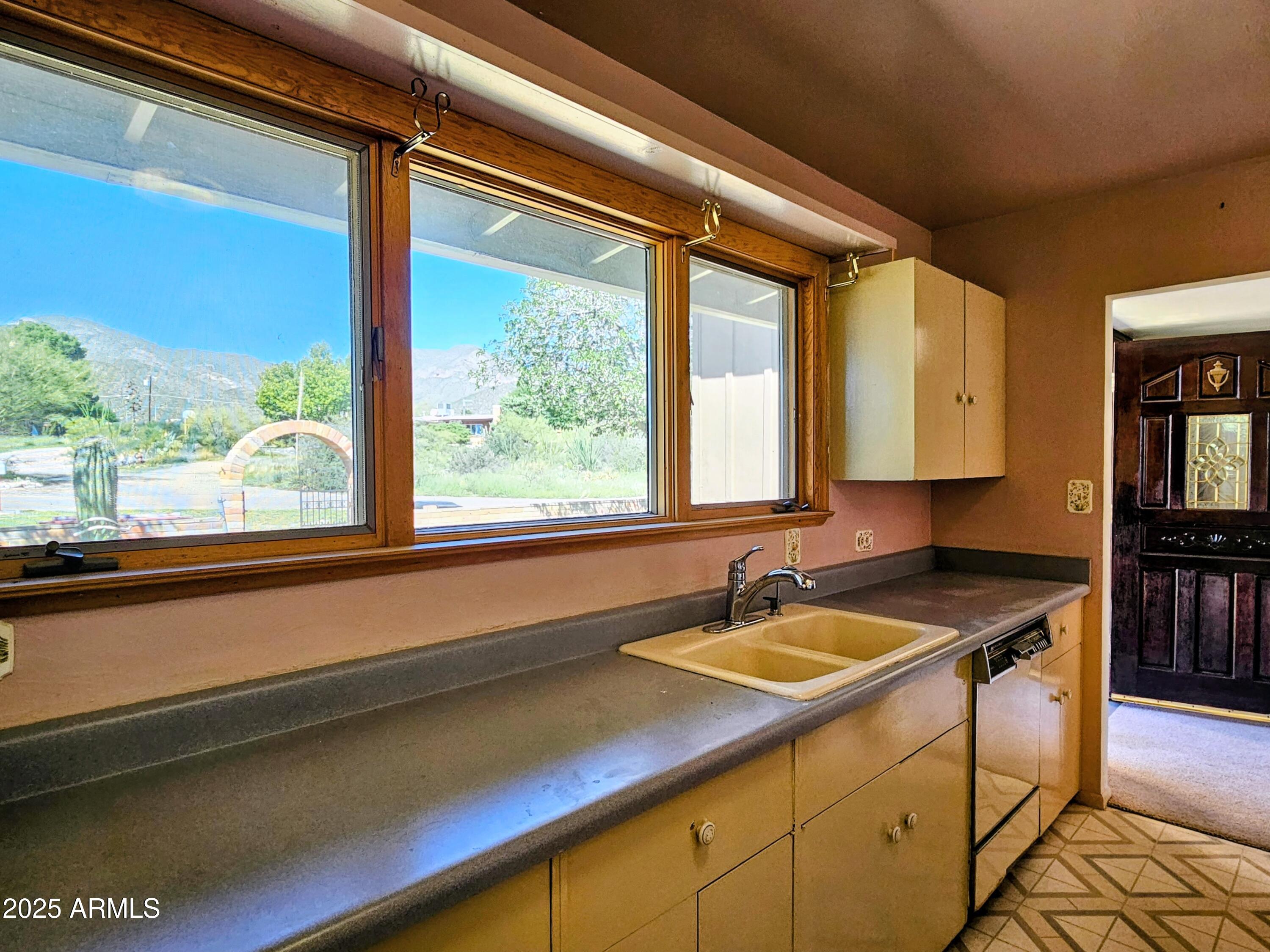 85 Pima Drive Bisbee, AZ 85603 - Photo 17 of 44 a kitchen with a sink and a window