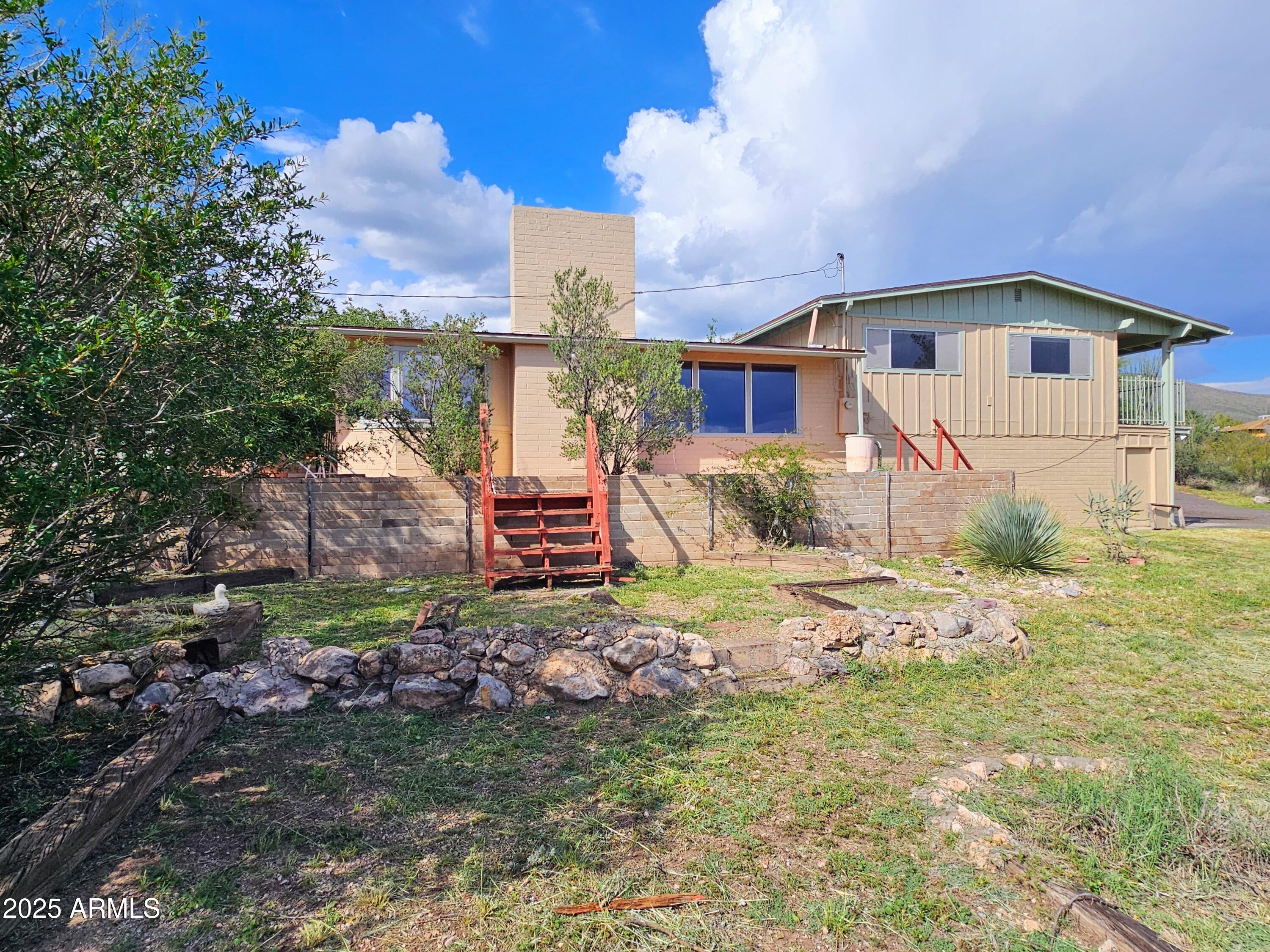 85 Pima Drive Bisbee, AZ 85603 - Photo 2 of 44 a front view of a house with a yard