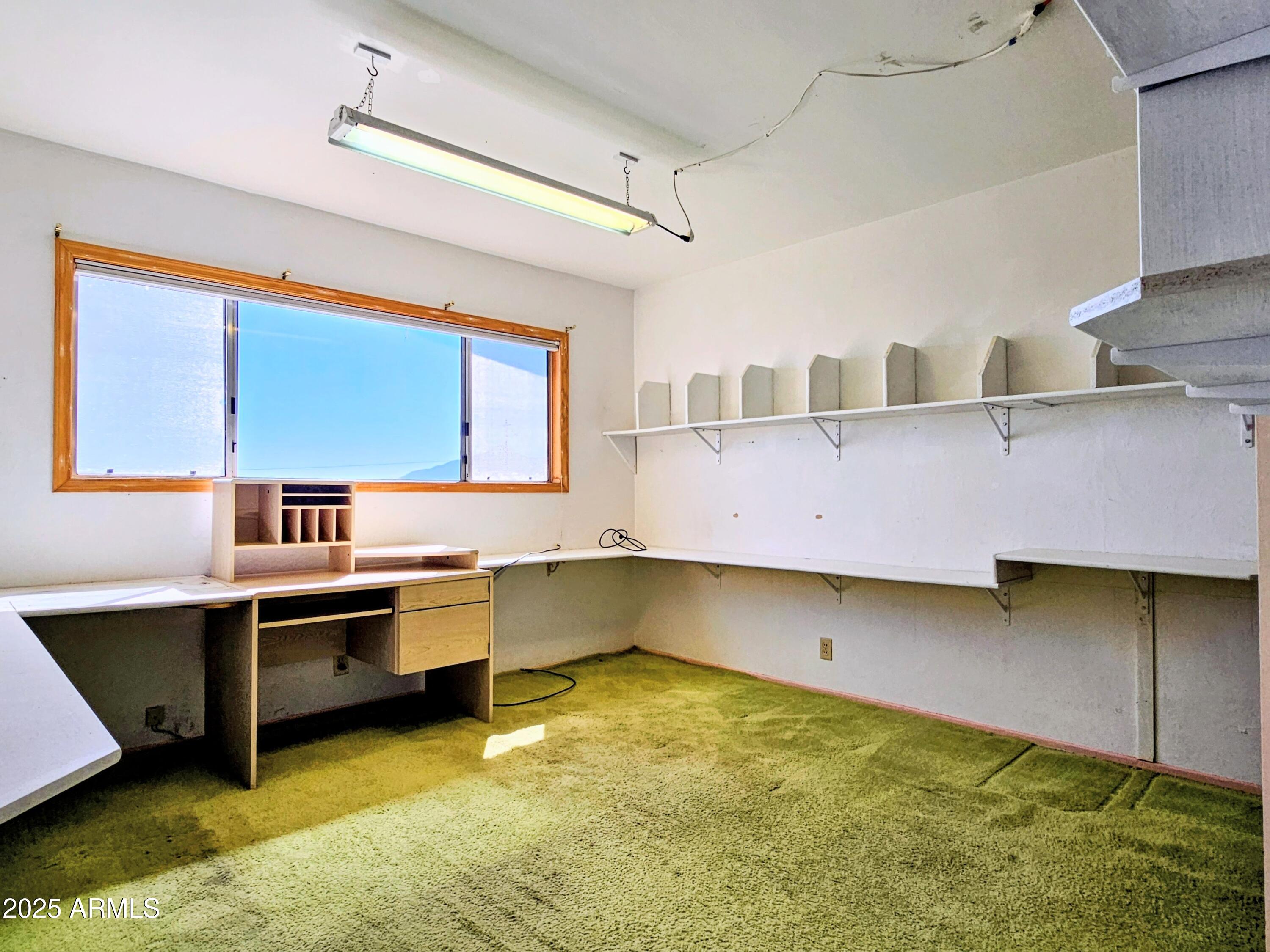 85 Pima Drive Bisbee, AZ 85603 - Photo 28 of 44 a kitchen with a sink and a stove