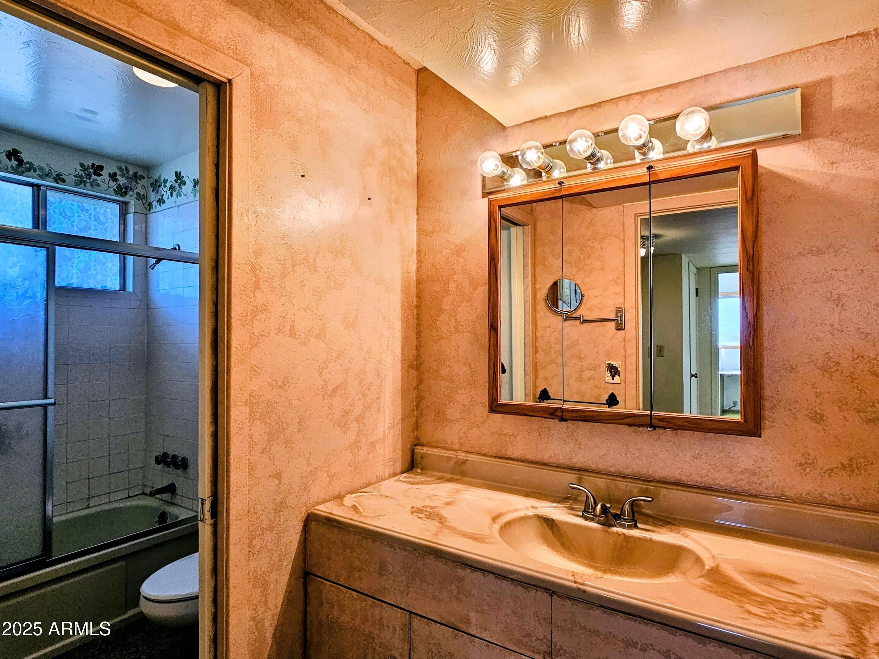 85 Pima Drive Bisbee, AZ 85603 - Photo 29 of 44 a bathroom with a sink and a mirror