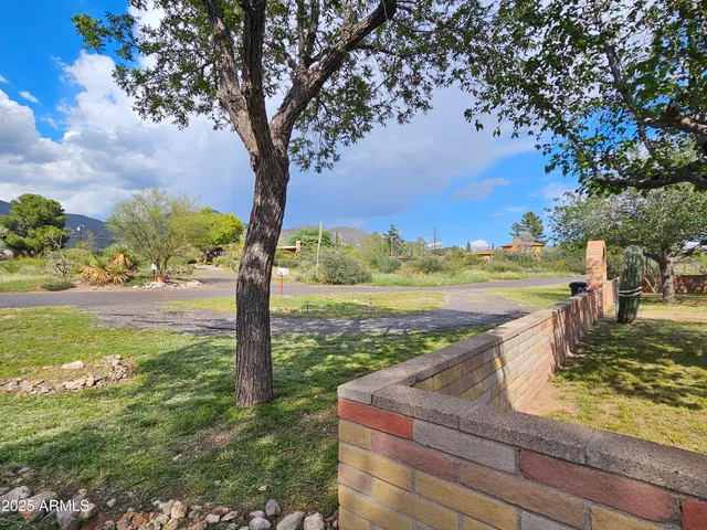 a view of a yard with an ocean view