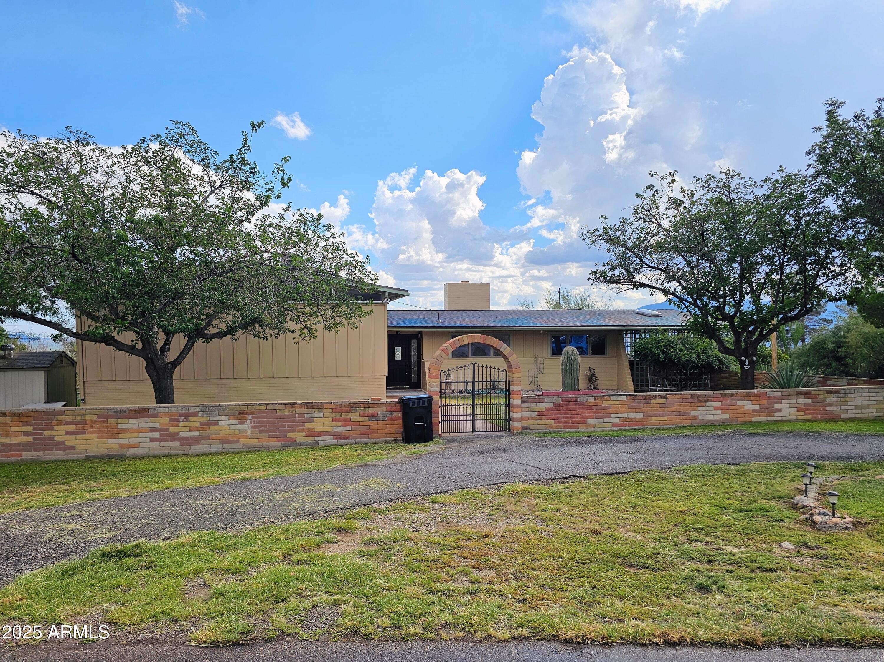 85 Pima Drive Bisbee, AZ 85603 - Photo 42 of 44 a front view of a house with garden