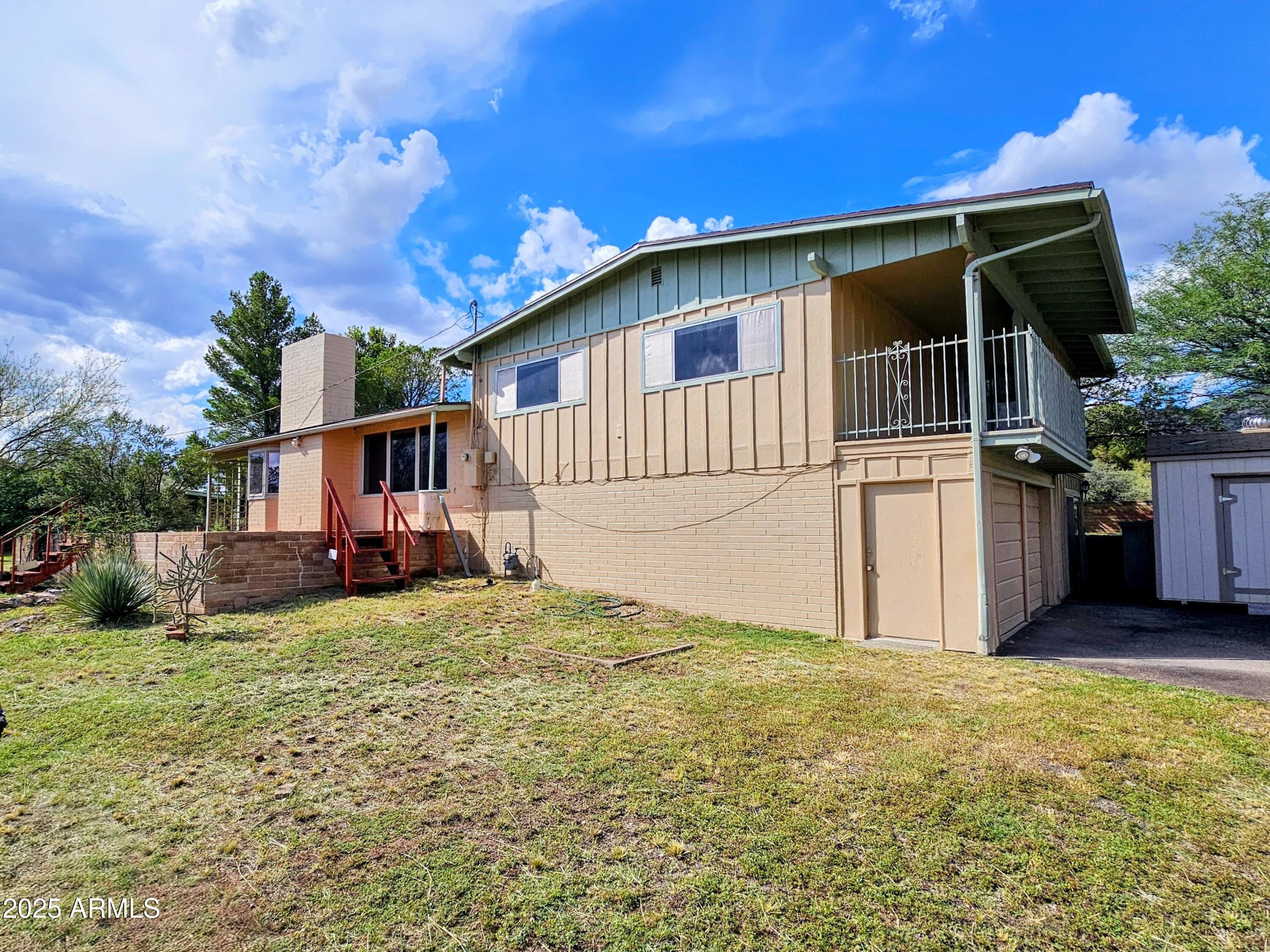 85 Pima Drive Bisbee, AZ 85603 - Photo 43 of 44 a view of a house with backyard and sitting area