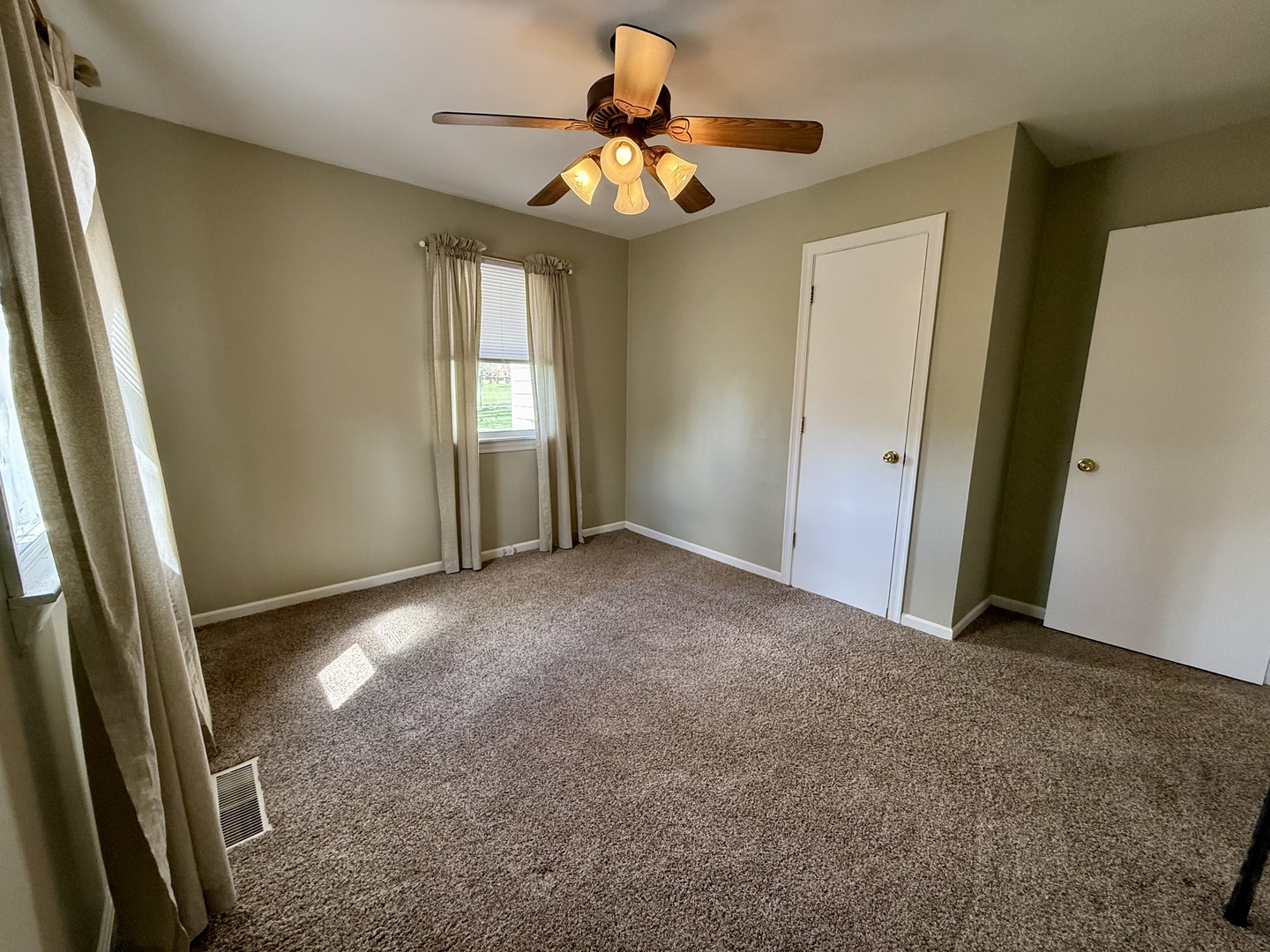 308 Illinois Drive Rantoul, IL 61866 - Photo 11 of 17 a view of an empty room with a window