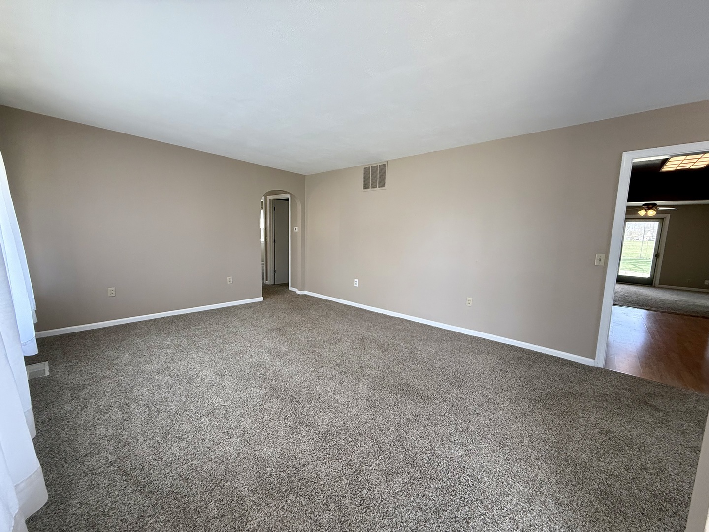 308 Illinois Drive Rantoul, IL 61866 - Photo 3 of 17 a view of an empty room with kitchen and a sink