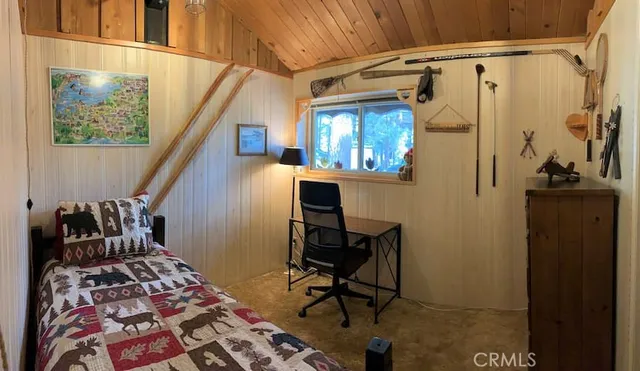 a balcony with wooden floor and furniture