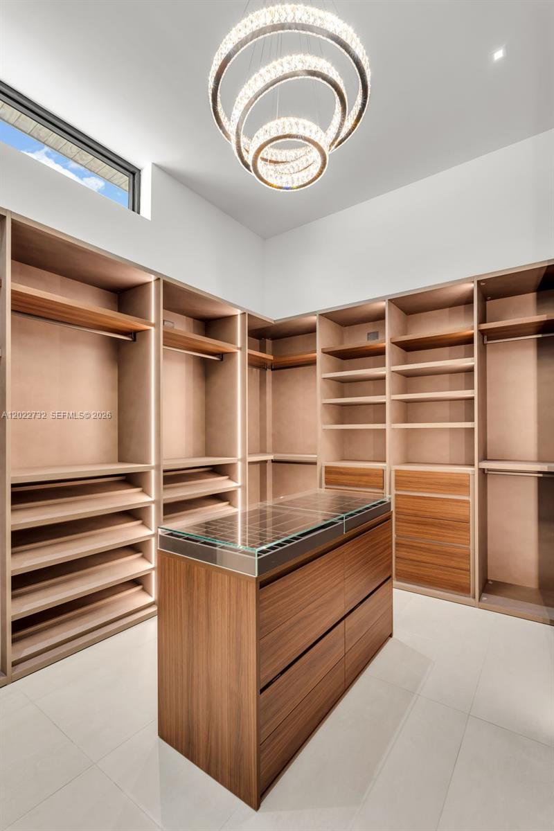 7825 Southwest 128th Street Pinecrest, FL 33156 - Photo 35 of 88 a view of walk in closet with empty racks