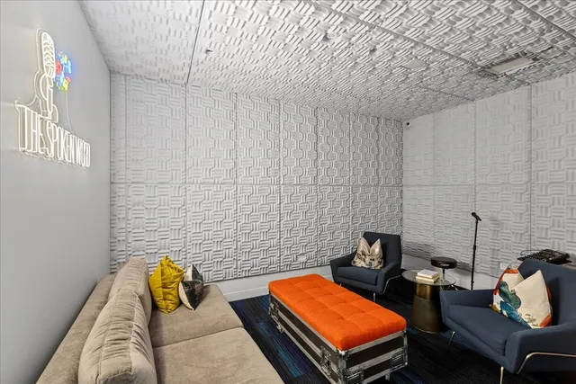 a view of a living room and floor to ceiling window