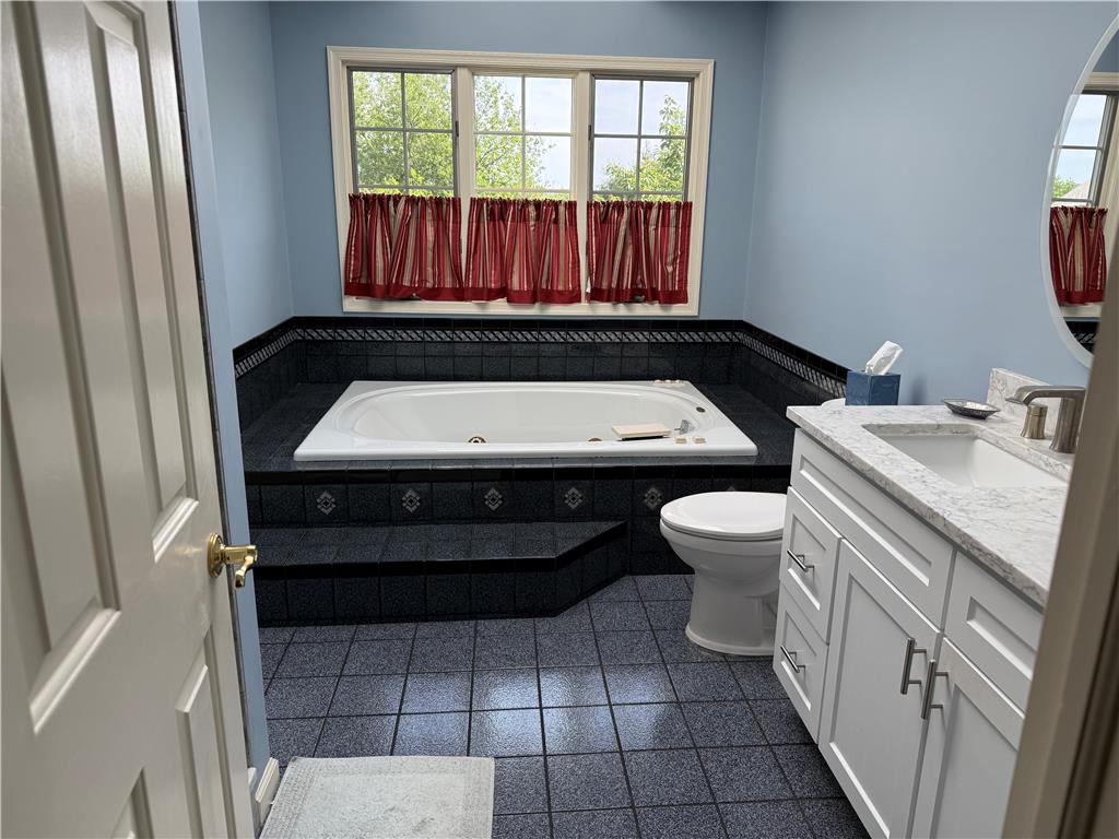 4114 Rochelle Drive Allentown, PA 18104 - Photo 28 of 35 Indulge in a primary bath featuring a spacious soaking tub and an elegant vanity with ample storage.