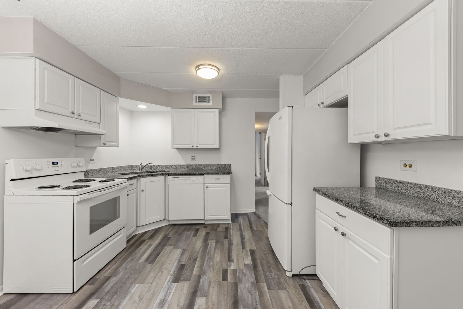 548 Timber Ridge Drive, Unit 108 Carol Stream, IL 60188 - Photo 6 of 18 a kitchen with cabinets appliances and a counter space