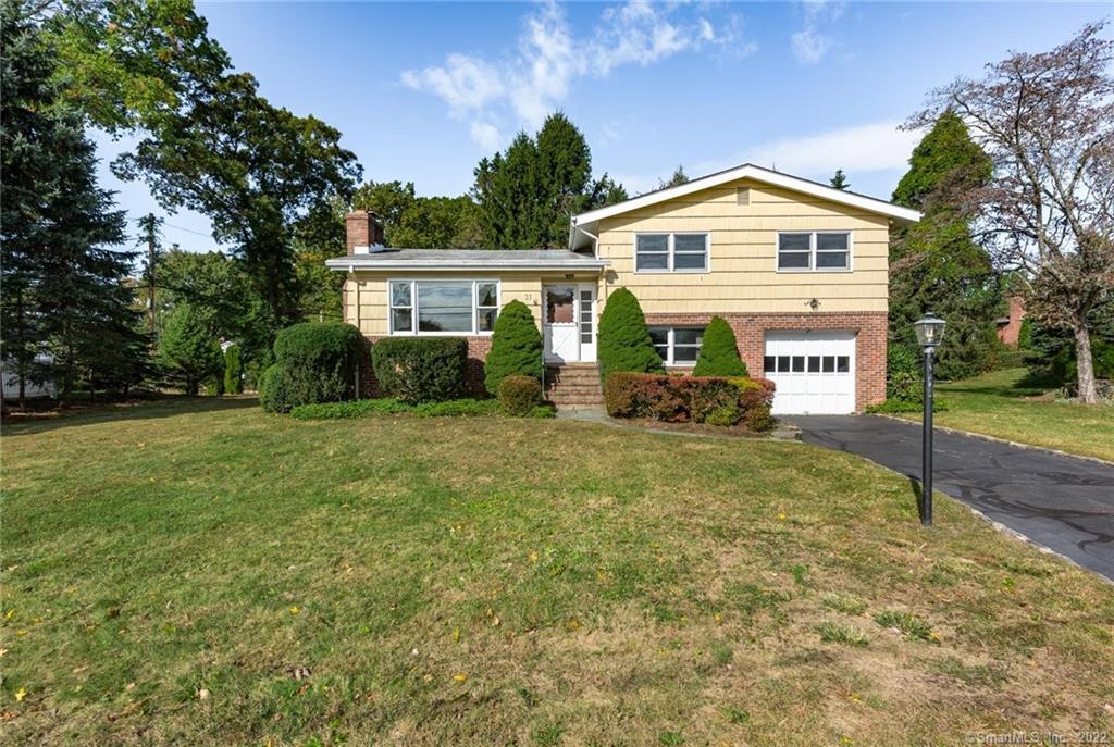 33 Ridge Street Greenwich, CT 06807 - Photo 1 of 1 a front view of a house with garden