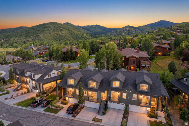 3355 Santa Fe Road Park City, UT 84098 - Photo 42 of 45 Townhome row featuring dark gray siding, white garage doors, and individual covered entryways
