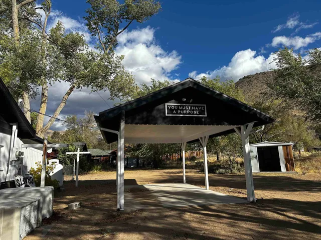 a view of a street with retail shops