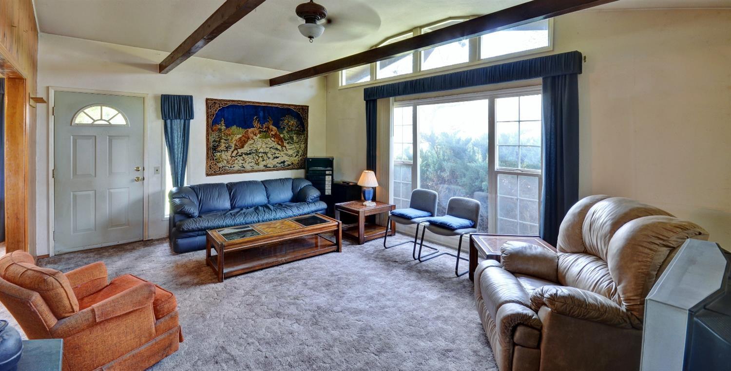 11610 Duggan Road White City, OR 97503 - Photo 6 of 28 a living room with furniture a rug and a large window