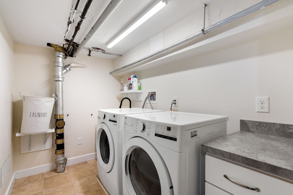 18 Moulton Road, Unit 1 Arlington, MA 02476 - Photo 12 of 16 a utility room with dryer and washer
