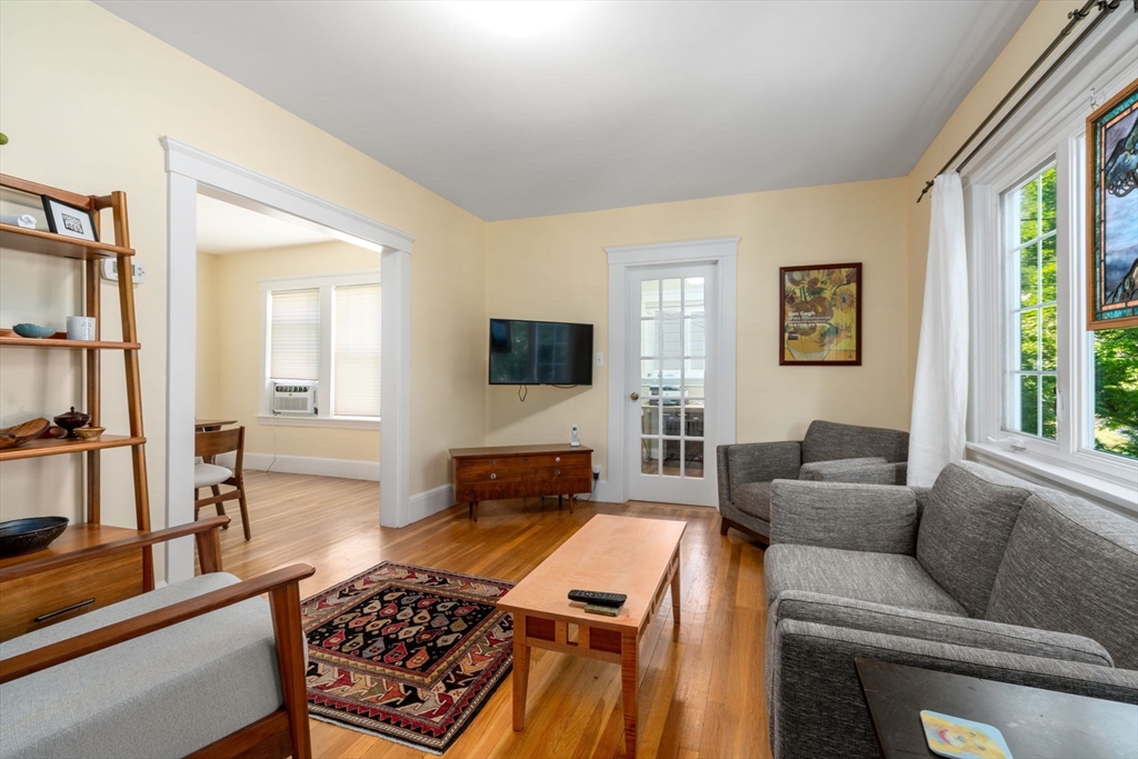 18 Moulton Road, Unit 1 Arlington, MA 02476 - Photo 2 of 16 a living room with furniture and a flat screen tv