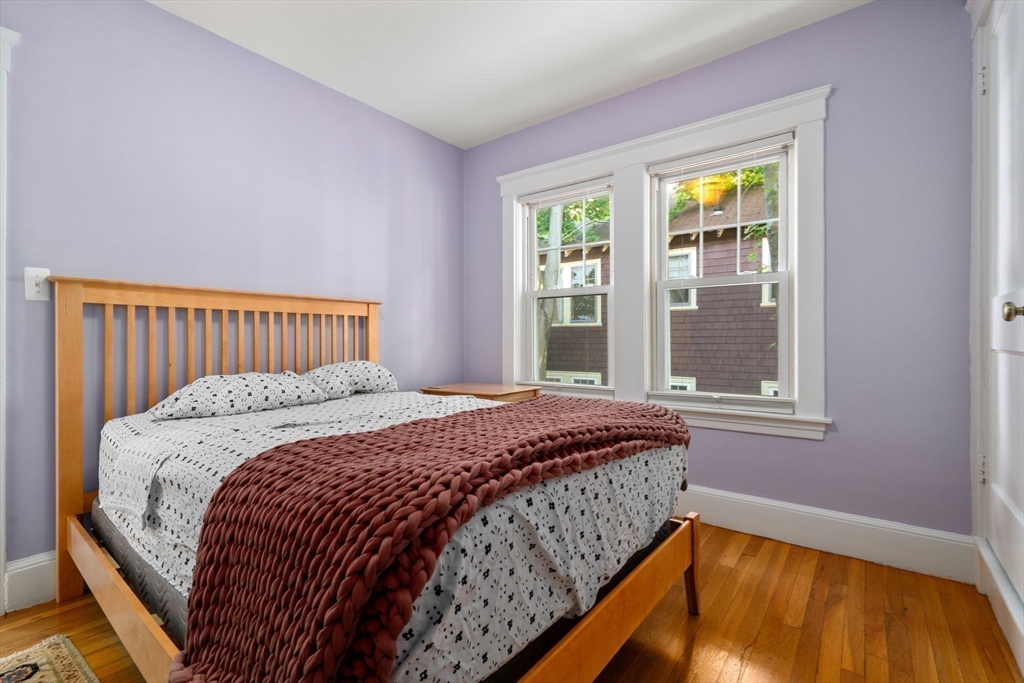 18 Moulton Road, Unit 1 Arlington, MA 02476 - Photo 8 of 16 a bedroom with a bed and a window