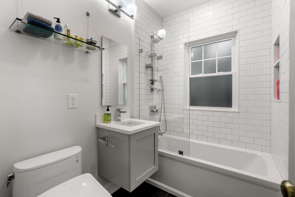 18 Moulton Road, Unit 1 Arlington, MA 02476 - Photo 10 of 16 a bathroom with a toilet a sink and bathtub
