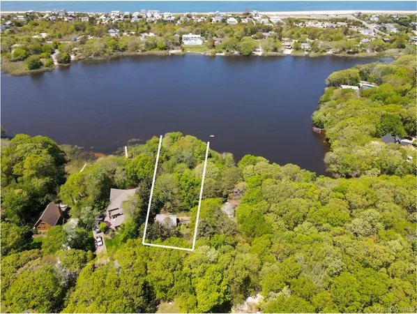 view of a lake with a house
