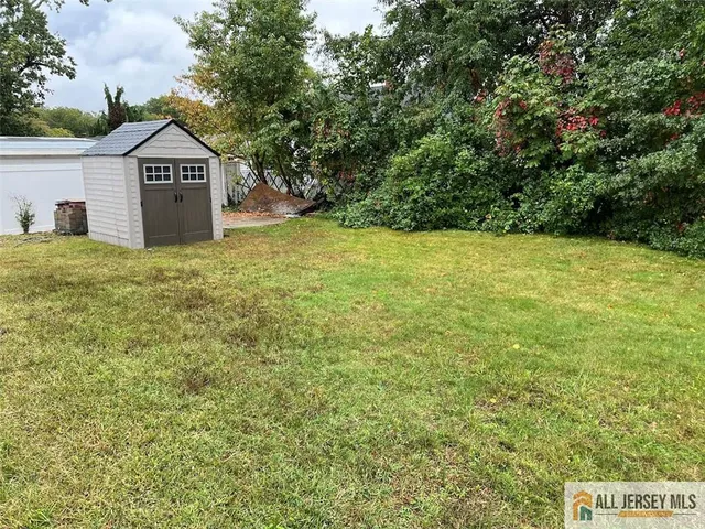 a sign board with a yard