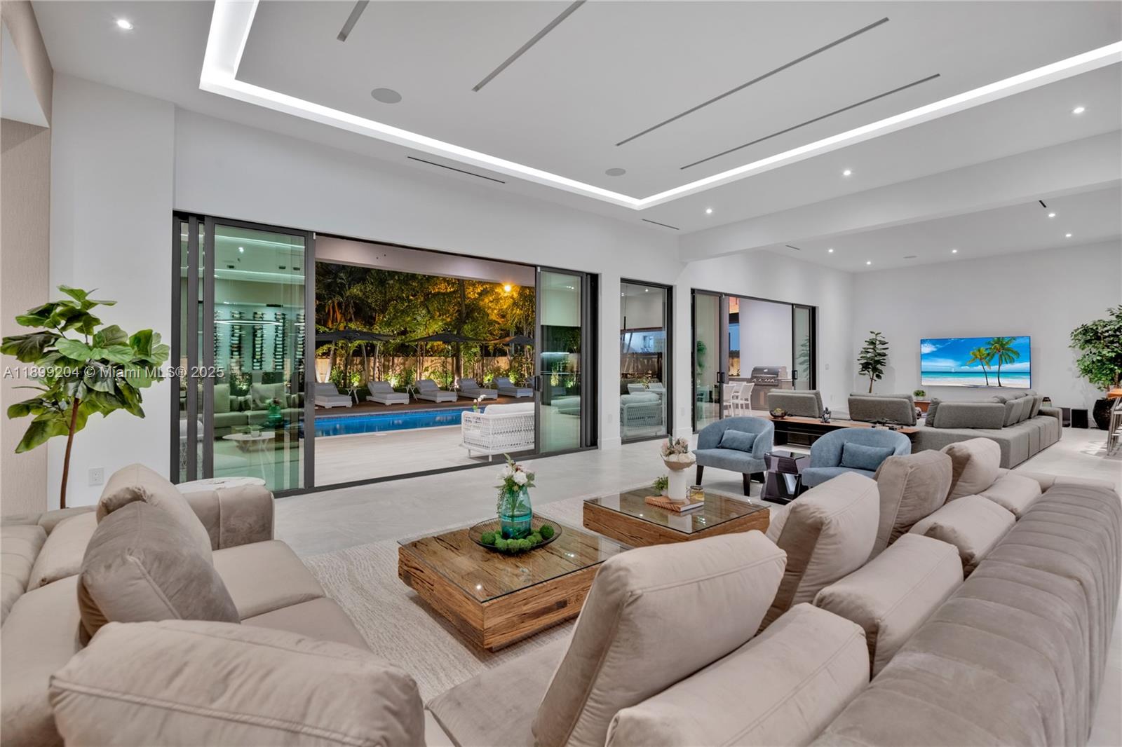 2110 Northeast 197th Terrace Miami, FL 33179 - Photo 13 of 77 a living room with furniture and a large window